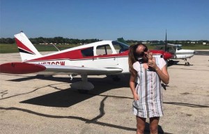 Quin with Dad's plane and ice cream cone